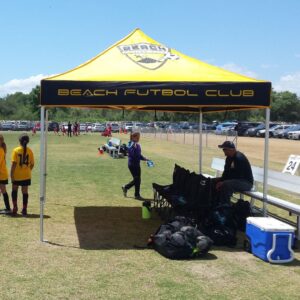 athletes meeting near a pop-up canopy