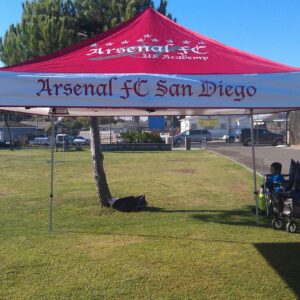 a pop-up canopy with school colors
